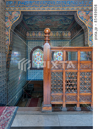 Wooden staircase, decorated wooden balustrade, Turkish ceramic tiles wall, ornate ceiling, stained glass windows, Residence hall at Manial Palace of Prince Mohammed Ali, Cairo, Egypt 85489808