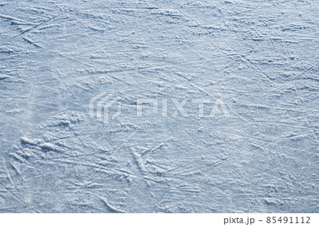 Ice skating rink, cutting ice, snow. Winter sport. Scratches on the surface of the ice. Close-up photo. 85491112