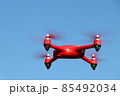 red drone on a blue sky background 85492034