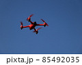 red drone on a blue sky background 85492035