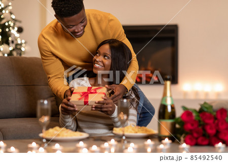 Black Husband Giving Valentine Gift To Wife During Dinner Indoor 85492540