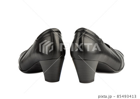Side view of heels on women's shoes on a white background. Side view of heels on women's shoes on a white background. 85493413