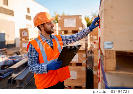 Contractor check delivered parcel at construction site Contractor check delivered parcel at construction site 85494728