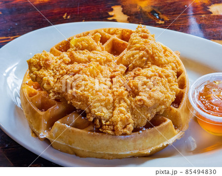 Close up shot of deep fried chicken with waffle 85494830