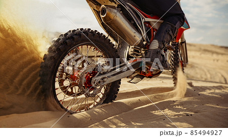 Rider driving in motocross race skid wheel 85494927