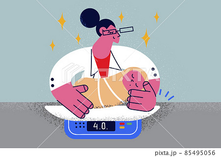 Caring nurse weigh newborn baby in clinic Caring nurse weigh newborn baby in clinic 85495056