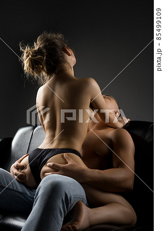 Shirtless man squeezing ass of woman sitting on top Shirtless man squeezing ass of woman sitting on top 85499109