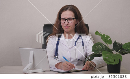 Point of View: Man Using Smartphone to Talk to His Doctor via Video Conference Medical App. Person Checks Symptoms, Talks with Physician, Using Online Video Chat Application. 85501028
