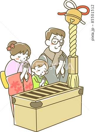 初詣でお祈りする若い夫婦と男の子 初詣でお祈りする若い夫婦と男の子 85501512