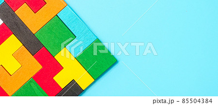 colorful wood puzzle pieces on blue background, geometric shape block. Concepts of logical thinking, Conundrum, solutions, rational, strategy, world logic day and Education colorful wood puzzle pieces on blue background, geometric shape block. Concepts of logical thinking, Conundrum, solutions, rational, strategy, world logic day and Education 85504384