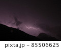 Lightnings in the mountains on a black and purple background. Lighting bolt, lightning  85506625