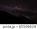 Lightnings in the mountains on a black and purple background. Lighting bolt, lightning  85506628