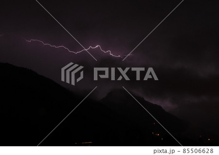 Lightnings in the mountains on a black and purple background. Lighting bolt, lightning Lightnings in the mountains on a black and purple background. Lighting bolt, lightning 85506628