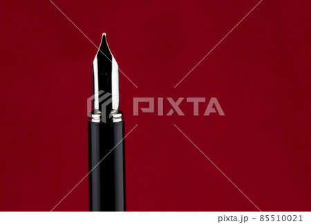 Fountain Pen Point on a Red Background 85510021