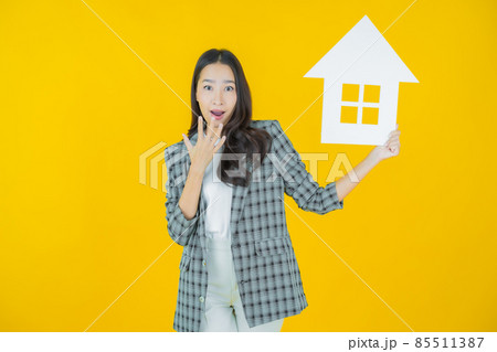 Portrait beautiful young asian woman with house or home paper sign Portrait beautiful young asian woman with house or home paper sign 85511387