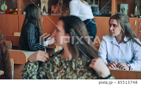Students in the classroom at their desks in front of the're coming out. Students in the classroom at their desks in front of the're coming out. 85513748