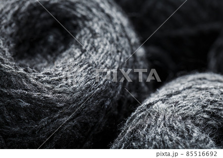 Gray yarn made of natural wool in balls of thread. Gray yarn made of natural wool in balls of thread. 85516692