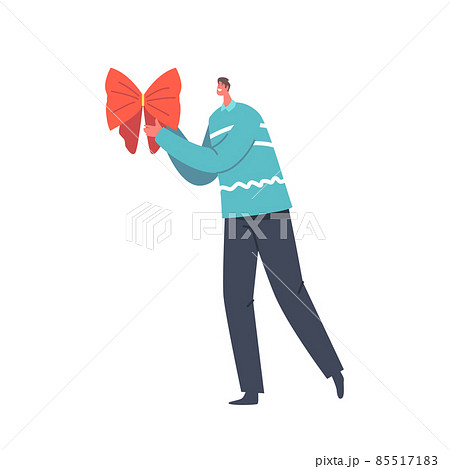 Preparation for Winter Holidays, Merry Christmas and Happy New Year Concept. Male Character Holding Festive Red Bow 85517183