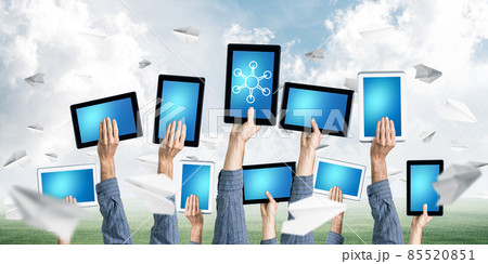 Close of businessman hands in line showing tablet pc with blank blue screen Close of businessman hands in line showing tablet pc with blank blue screen 85520851