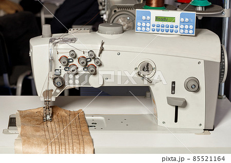 Professional programmable sewing machine for hemming and sewing clothes. Close-up. 85521164