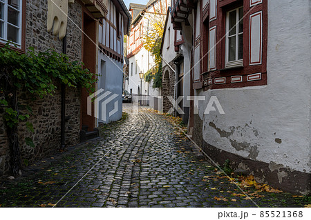 A narrow street in an old Mosel valley town, Germany. Beautiful old houses A narrow street in an old Mosel valley town, Germany. Beautiful old houses 85521368