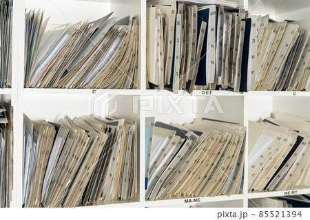 Shelves are full with folders and files of medical record, patient information 85521394