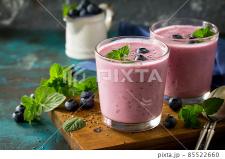 Healthy Chia seed pudding in a glass with blueberry on slate table. Healthy breakfast, vitamin snack, diet and healthy eating. Healthy Chia seed pudding in a glass with blueberry on slate table. Healthy breakfast, vitamin snack, diet and healthy eating. 85522660