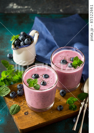 Healthy Chia seed pudding in a glass with blueberry on slate table. Healthy breakfast, vitamin snack, diet and healthy eating. Free space for your text. 85522661