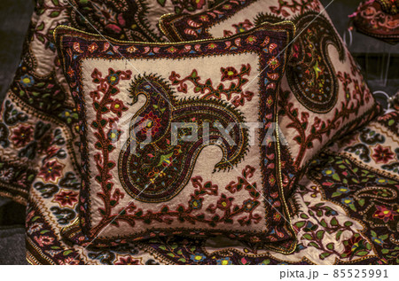Oriental set of woolen fabric, pillow with a bedspread, embroidered with paisley patterns, and twigs with flowers 85525991