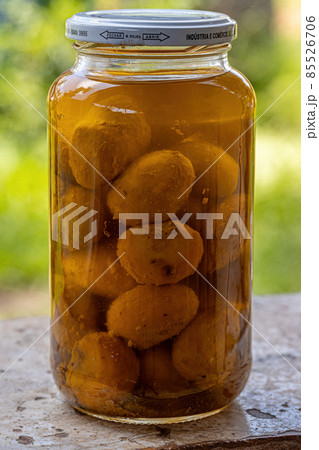 Itaja, Goias, Brazil - 12 24 2021: Pickled pequi in oil 85526706