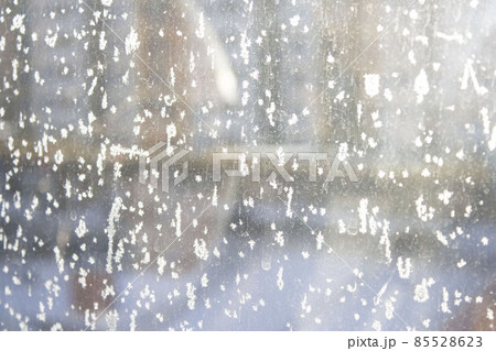 Abstraction, texture, background. Frosty pattern on the window. Winter. December. January.February. 85528623