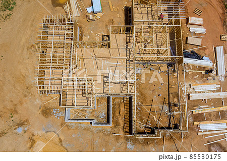 Aerial view the a new house under construction wood framing beams 85530175