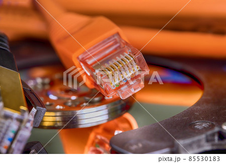 Selective focus at internet network cables connected with online storage files backup Selective focus at internet network cables connected with online storage files backup 85530183