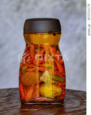 Jar of chili pepper preserves 85533179