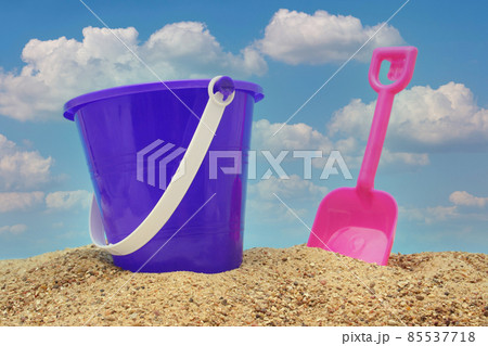 Sand Pail and Shovel on Beach With Blue Sky Sand Pail and Shovel on Beach With Blue Sky 85537718