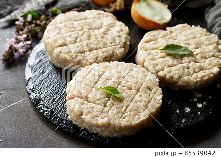 Raw fresh cutlets burger from beef for homemade burgers cooking with spices close-up. Raw fresh cutlets burger from beef for homemade burgers cooking with spices close-up. 85539042