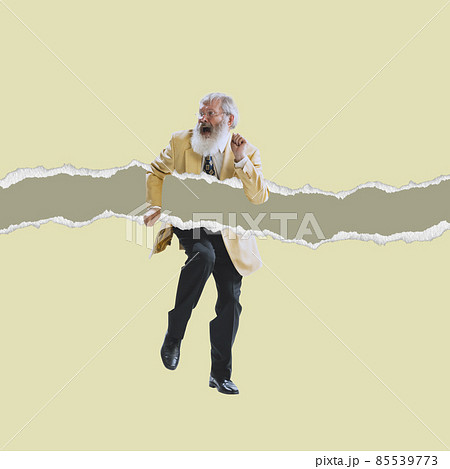 Senior man wearing retro style suit dancing isolated on torn paper background. Contemporary art collage. Minimalism Senior man wearing retro style suit dancing isolated on torn paper background. Contemporary art collage. Minimalism 85539773