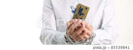 Female tied hands with plastic credit bank cards chain closeup 85539841