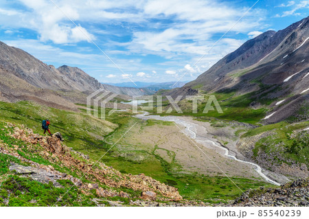 Extreme expedition in the mountains. Travel photographer take a picture of misty beautiful view in high snow mountains. Travel freelancer blogger lifestyle, concept adventure voyage outdoor. 85540239