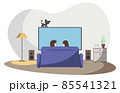 A man and a woman are sitting at home on the sofa in front of the TV. A grey cat walks on TV. Rear view. 85541321