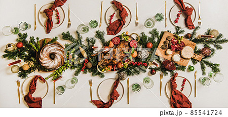 Flat-lay of Festive Christmas table setting over Flat-lay of Festive Christmas table setting over 85541724