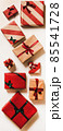 Festive gift boxes in wrapping paper for 85541728