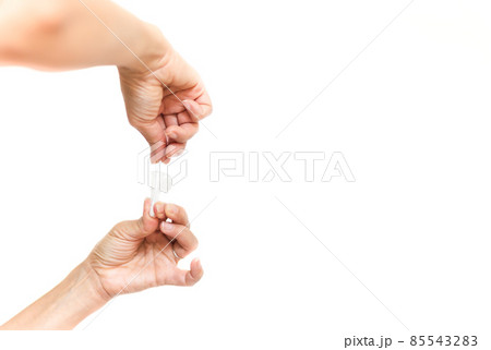 Woman swab COVID-19 testing by Rapid Antigen Test kit isolated in white background. 85543283