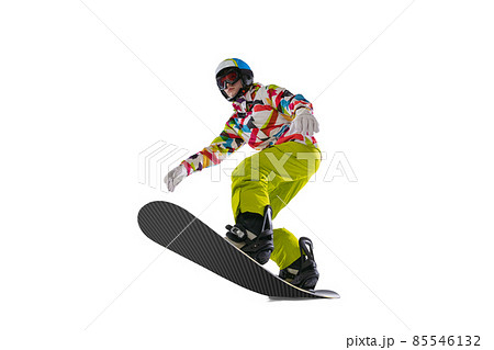 Young sportive woman in bright sportswear, goggles and helmet snowboarding isolated on white studio background. Concept of winter sports 85546132