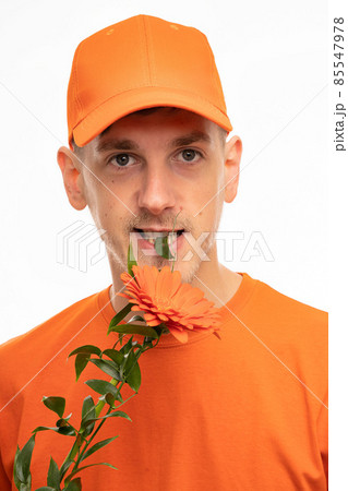 Young man with flower on white Young man with flower on white 85547978