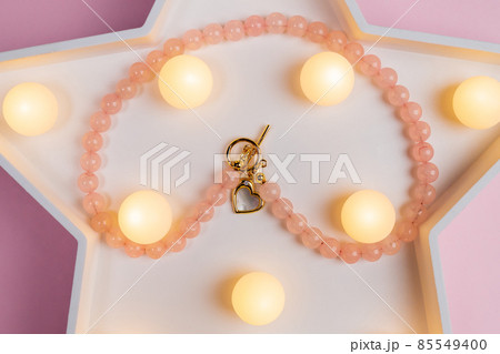 Genuine Natural Pink Quartz Untreated Natural Real Gemstone Beads close up. Selective focus. 85549400