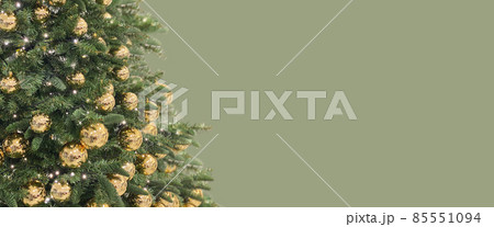 Christmas tree golden baubles lights. Long green banner 85551094