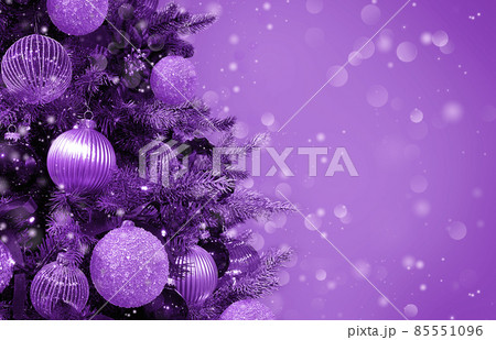Christmas tree ornaments baubles lights violet purple background Christmas tree ornaments baubles lights violet purple background 85551096