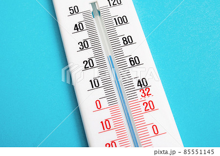 White room thermometer on a blue background 85551145