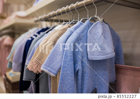 closeup of baby clothes on rack in a flea market. 85552227